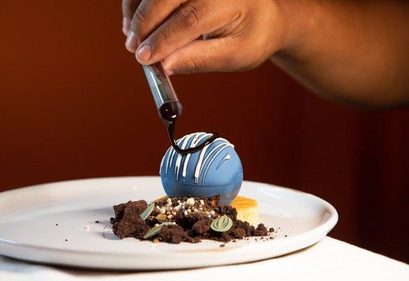 The Chocolate Globe, a signature dessert inspired by the Planet Word museum's Globe in the Great Hall.