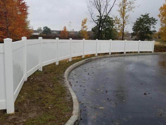 White vinyl privacy fence.