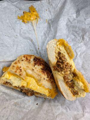 Chorizo and egg on a scored garlic bagel...with a bit of cheese pull.