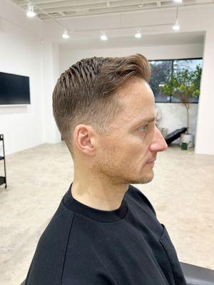 a modern, textured look with a side part