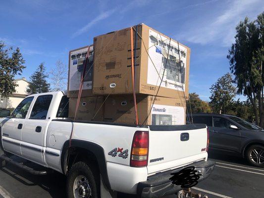 Boxes tied down to truck