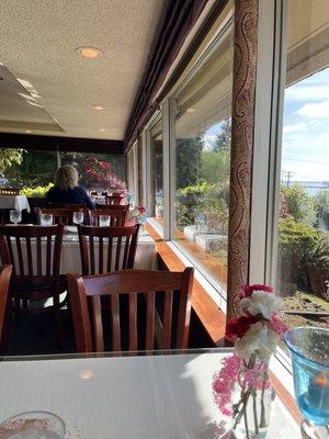 Lower dining area looking at beautiful gardens and bay.