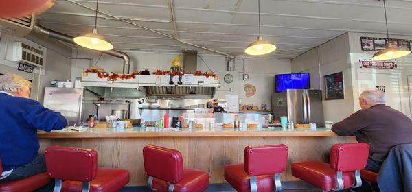 Bar seating and kitchen