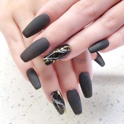 Black matte nails with marble design