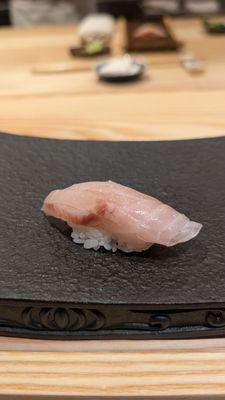 Ishigakadai (Knifejaw snapper). Crunchy outside, two slices, topped with seaweed salt.