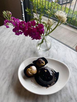 Velina dessert (Hazelnut & chocolate mousse, hazelnut brittle center, covered in dark chocolate) accompanied with cream puffs