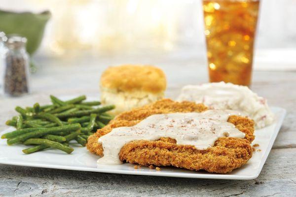 Homestyle Chicken-Fried Steak, smothered in country sausage gravy, served with mashed potatoes, choice of one side and a buttermilk biscuit