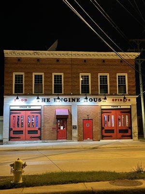 The front of the restaurant at night.