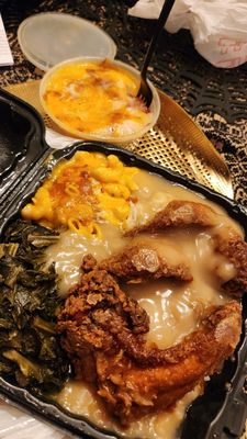 Smothered wings, loaded mashed potatoes, collard greens and Mac and cheese.