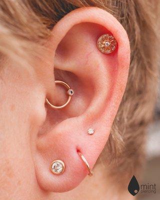 Daith, scapha and lobe piercings with BVLA rose gold and diamonds