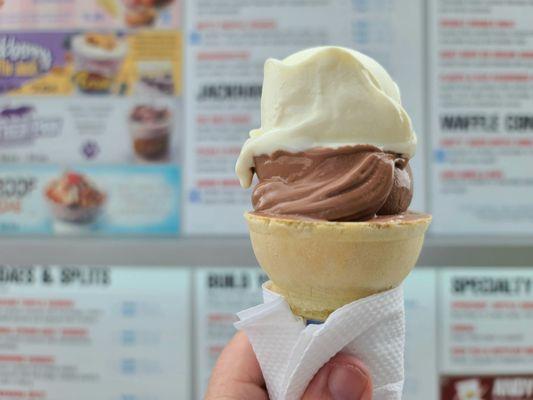 Small cake cone with vanilla and chocolate.