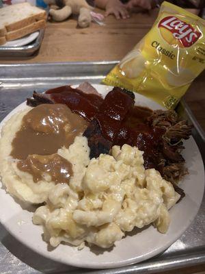 Macaroni and Cheese, Mashed Potatoes, pulled pork, BBQ Rib, Smoked Angus Brisket.