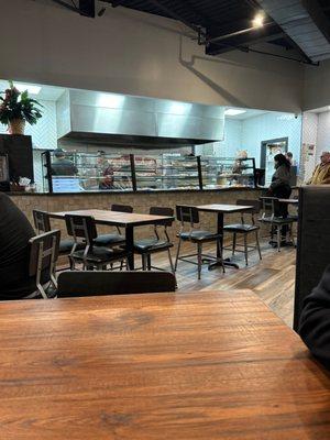 Dining area & counter at the pizzeria side