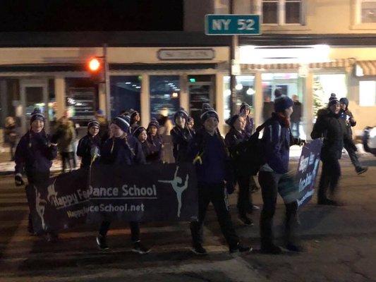 Our dance company marching in the tree lighting parade