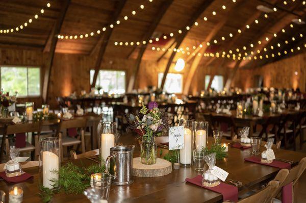 Table decorations with rented items and flowers/greenery.