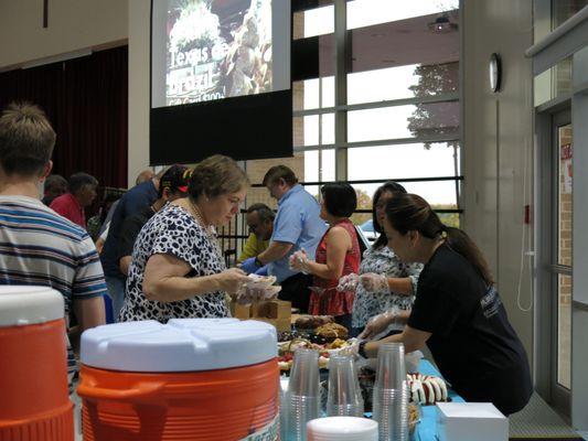 Family Friendly Events Feast of St. Michael Volunteers serving..