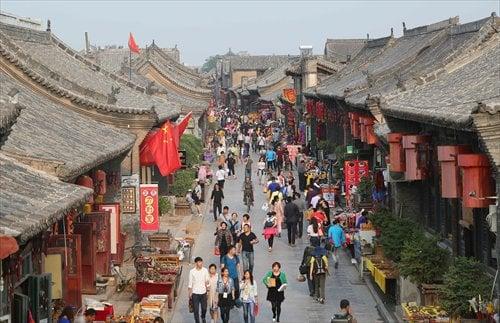 Tourists take in the sights in Pingyao, Shanxi Province.(7 days Jiangnan tour $99 plus airfare (5 star Hotel, meals )