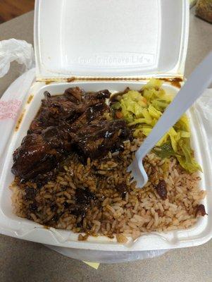 Stew chicken, rice beans, vegetables.