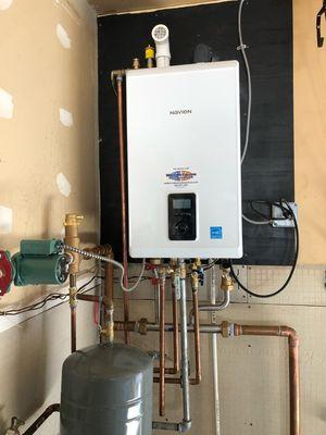 A recent Navien tankless water heater and boiler combination unit.  A space saver and you never run out of hot water!