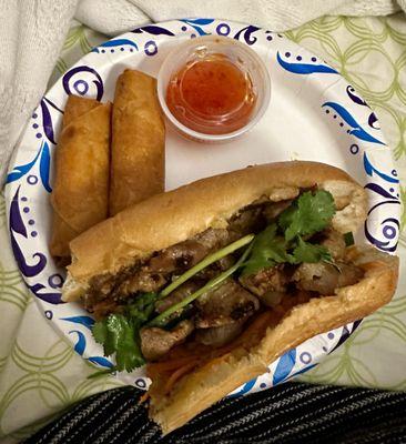 Partially eaten bahn mi (sorry I forgot to take photo until after I had already eaten a few bites), egg rolls with dipping sauce