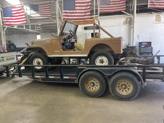 Customer brought in a jeep to install the engine, transmission, and muffler.