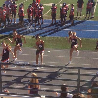 The Girl Child and cheer squad cheering at their 1st game of the season... Now watch me whip!!