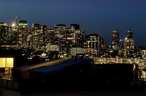 A stunning downtown Seattle view from a balcony provides a breathtaking sight of the city skyline.