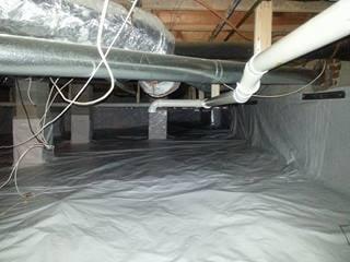 After pictures of crawl space encapsulation.  It has been caulked, sealed and mechanically fastened to the wall.