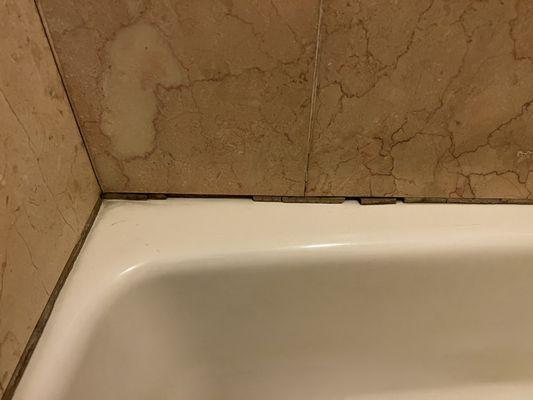 Cosmetic damage from previous guests. This is unsanitary and unsafe due to mold in the crack.