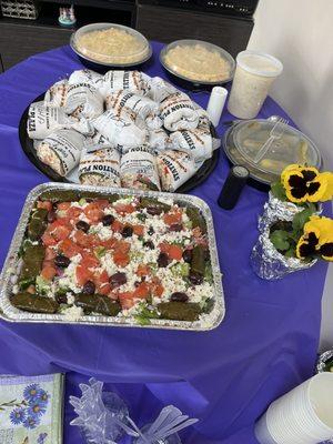 Assorted wraps, greek salad, potato salad, cole slaw, greek dressing and pickles.