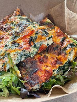 Spinach Egg Fritatta on a bed of Spring Mix Greens