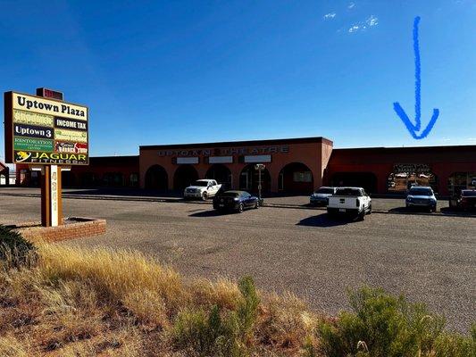 The Corner Barber Shop is located in the Uptown Plaza, right next to the now defunct triplex cinema. There's plenty of excellent parking.