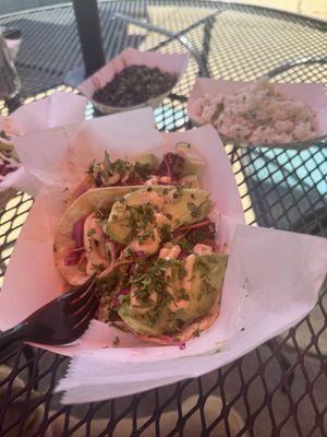 Mahi tacos, blackened shrimp tacos, lime rice and black beans.