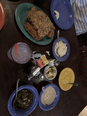 Chicken fried steak on top of a pile of fried chicken. Corn, green beans, mashed potatoes and gravy.... And the sides are BOTTOMLESS!!!