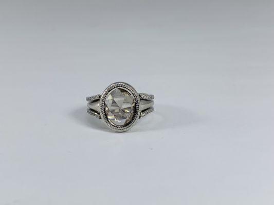 Custom made platinum ring and jacket. Center is an antique rose cut oval shape diamond.