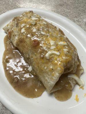 Breakfast Burrito smothered in Green Chili.