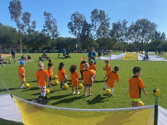 Our 3yo's setting up to learn the soccer skill of the week