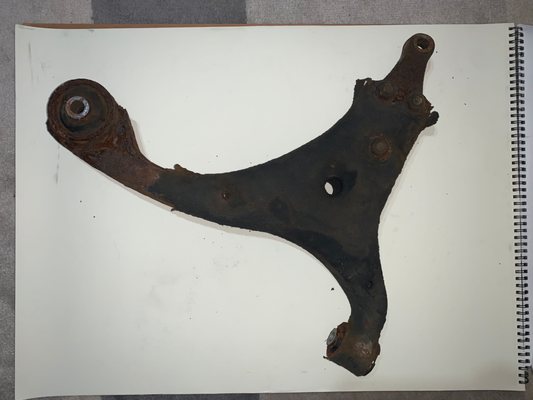 Corroded left lower control arm