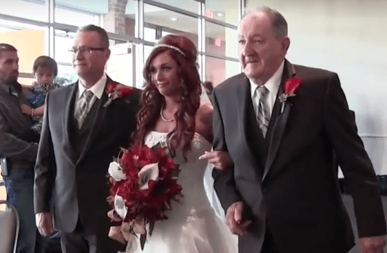 Father and Grandfather walking the bride down the isle.