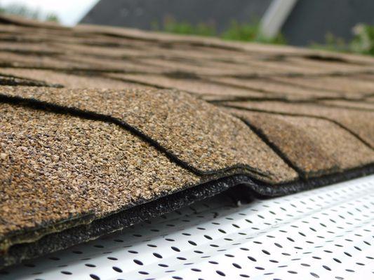 screws put in parallel to the roof and the heads are popping through the shingles!!