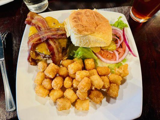 Bacon burger ($9 as of 12/2023) with tots.  Especially for the price, this is an awesome burger.