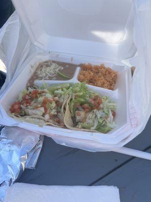 Carnitas and fish taco combination plates.