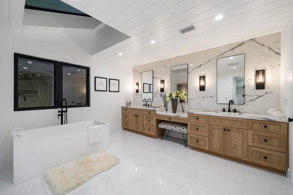 Complete bathroom remodel + Custom European white oak cabinets. Porcelain slabs and porcelain flooring white tiles.