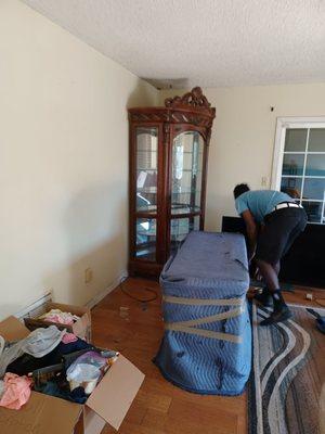 Michael was wrapping our TV stand getting ready to wrap our big cabinet