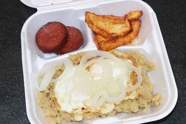 Classic Dominican breakfast. Fried cheese, salami, and mangu with fried eggs and sweet onions.