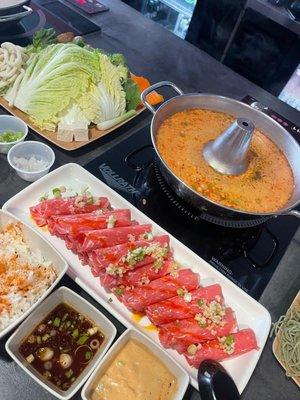 Sukiyaki mixed with spicy miso broth, Angus beef, sauces, rice and veggies