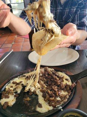 Queso flameado with fajita beef