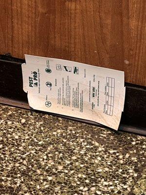 A glue pest trap right at the kitchen entrance