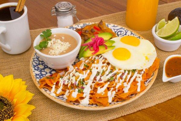 Chilaquiles Plate with eggs and red salsa