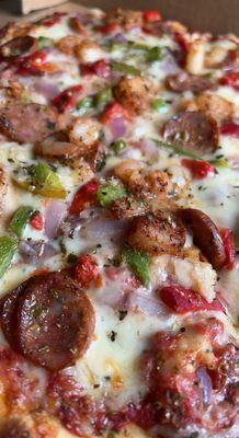 Tchoupitoulas Pizza. cajun shrimp, house roasted red pepper, green pepper, red onion, andouille sausage, fresh garlic